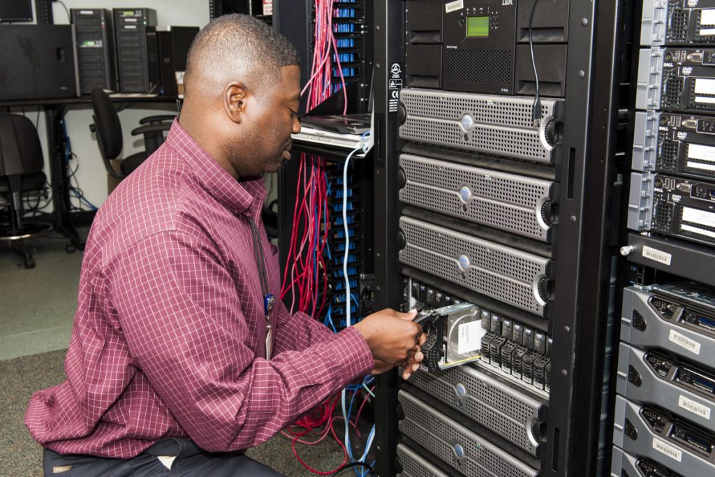 Information Technology staff District staff working on network storage equipment