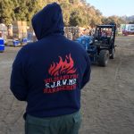 Person standing with Wildland Fire Management hoodie