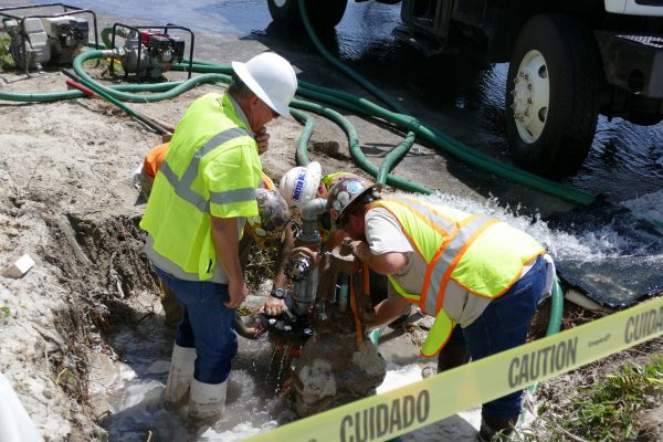 District staff on site of a well plugging operation