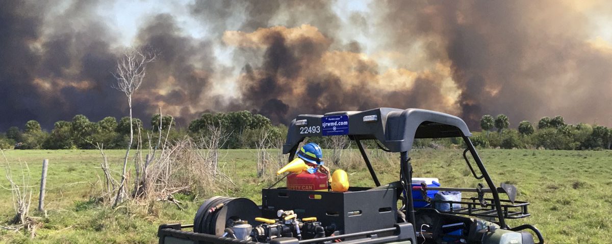 District staff keeping an eye on a prescribed fire