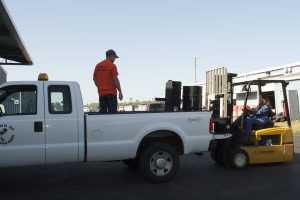 District staff donating surplus items at part of the REDI program