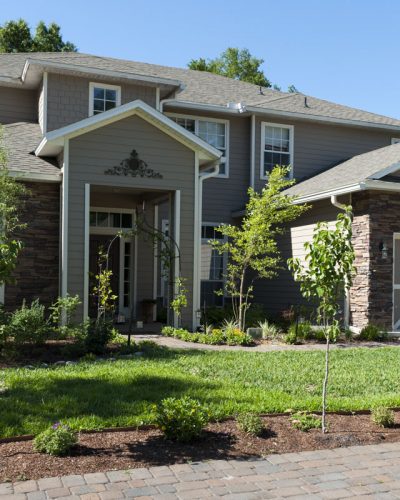 Landscaping example Two story house with landscaped front yard