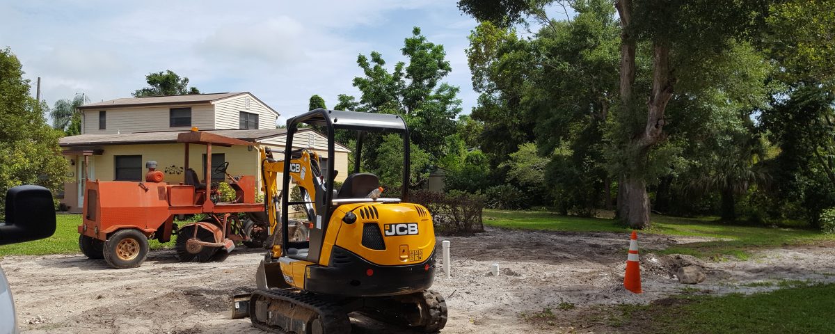 Construction equipment sitting outside of a house