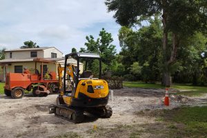 Construction equipment sitting outside of a house