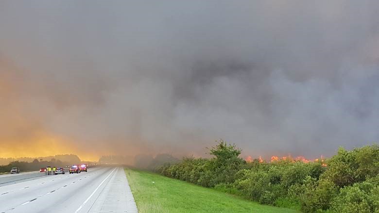 Highway covered with smoke from a wildfire