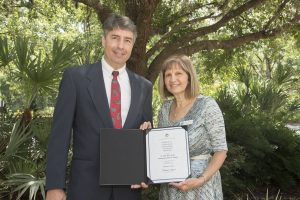 Mary-Lou Pickles and Greg Rockwell with a finance award