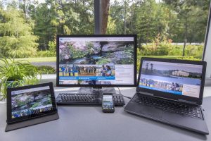 Tablet, phone, desktop and laptop computers showing the district's website