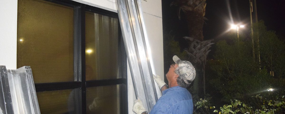 Staff securing the Palm Bay Service Center before a hurricane