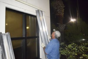 Staff securing the Palm Bay Service Center before a hurricane