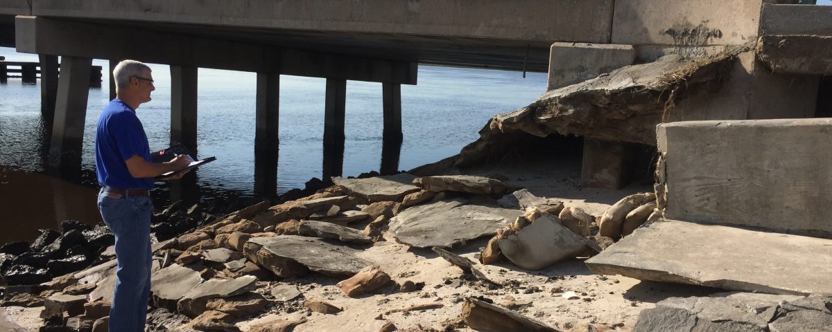 Robert Zammataro checking a bridge for damage after Hurricane Irma