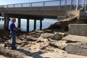Robert Zammataro checking a bridge for damage after Hurricane Irma