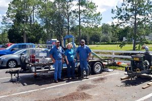 Dr. Ann Shortelle visiting staff that are pumping floodwater in Palatka