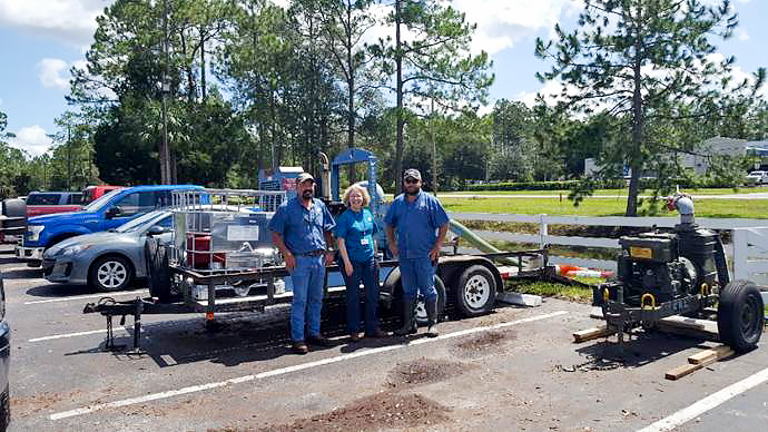 Dr. Ann Shortelle visiting staff that are pumping floodwater in Palatka