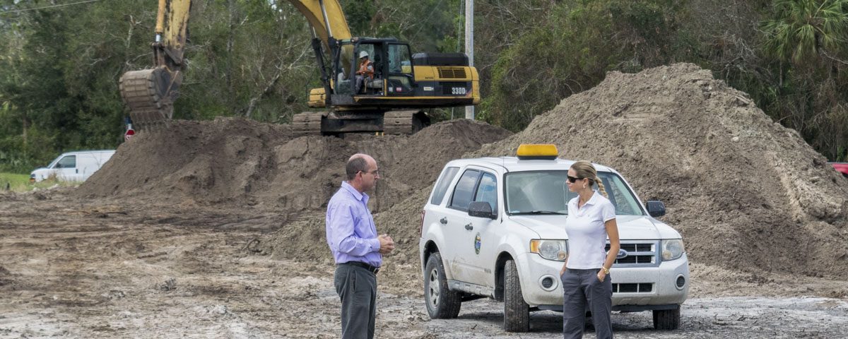Melisa Diolosa meeting with the City of Fellsmere's community development director at a stormwater project