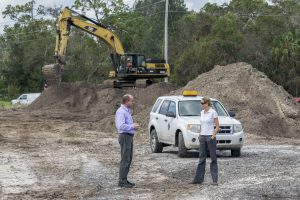 Melisa Diolosa meeting with the City of Fellsmere's community development director at a stormwater project