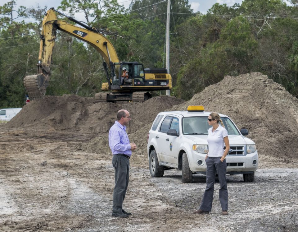 Melisa Diolosa meeting with the City of Fellsmere's community development director at a stormwater project