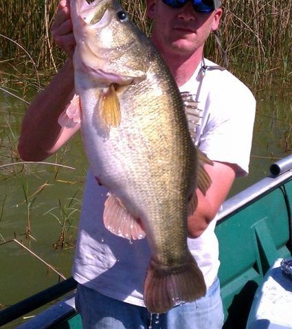 Fisherman with largemouth bass caught on Lake Apopka