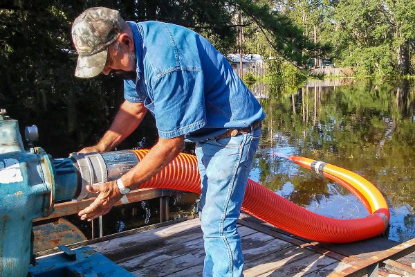 District staff pumping floodwater after a hurricane
