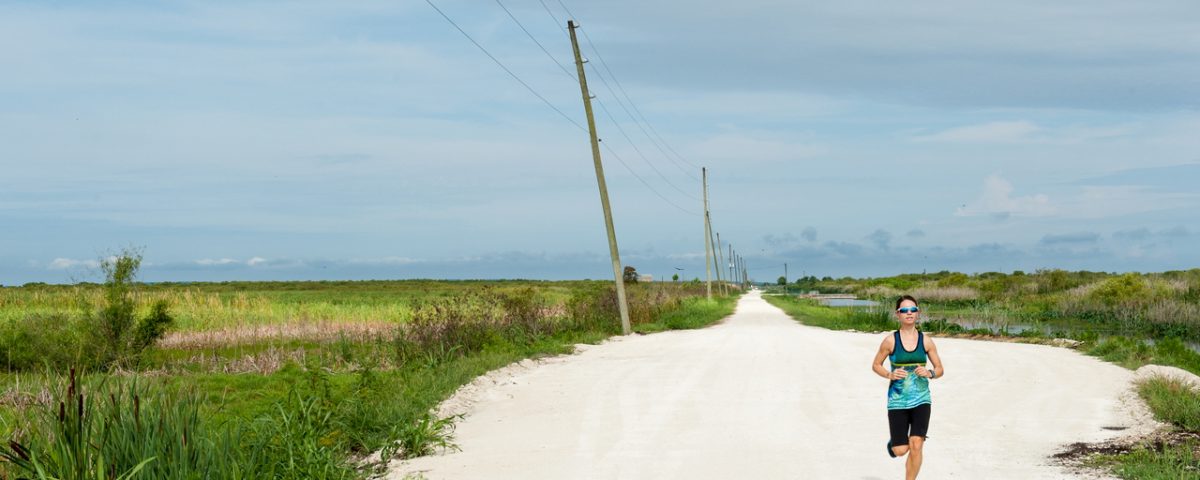 Person running on trail at Lake Apopka North Shore