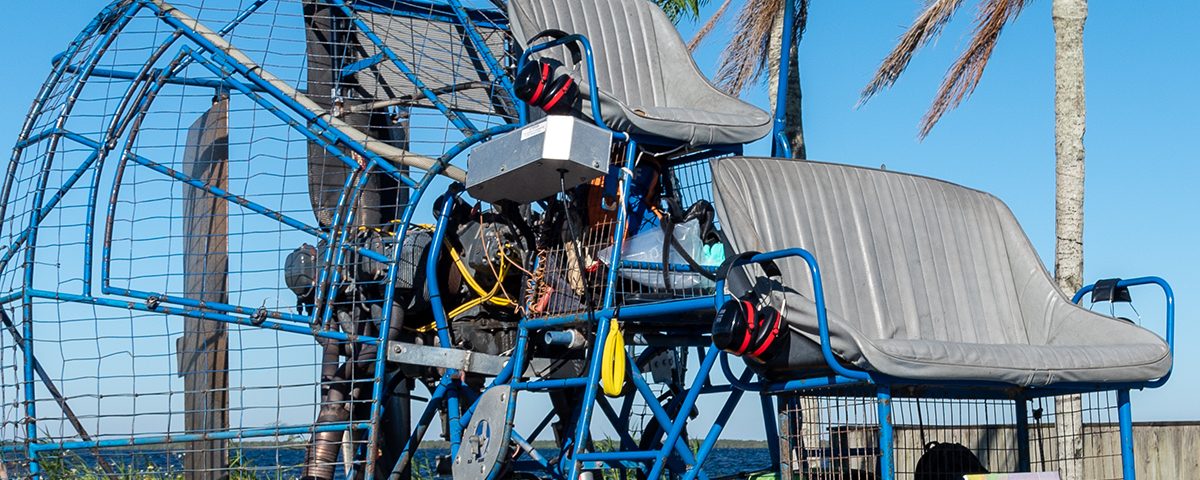 Airboat sitting along a water body