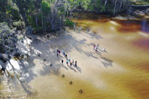 Aerial of students on the shore of the St. Johns River near Jacksonville
