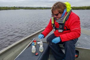 Matt_Preserving_with_Acid Matthew Watkins preserving water samples taken from a restoration site