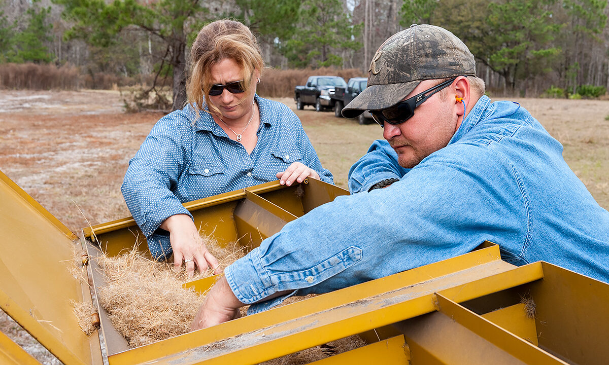 Venter-loading-spreader Marston Holbrook and Heather Venter loading a hopper