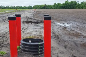 Farm field with pipes in the foreground