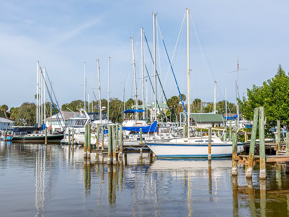 Sail boats docked in a harbour