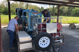 District staff working on pumping equipment