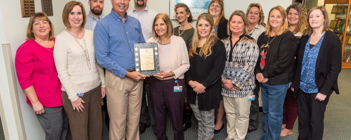 Office of Financial Services staff receiving an award