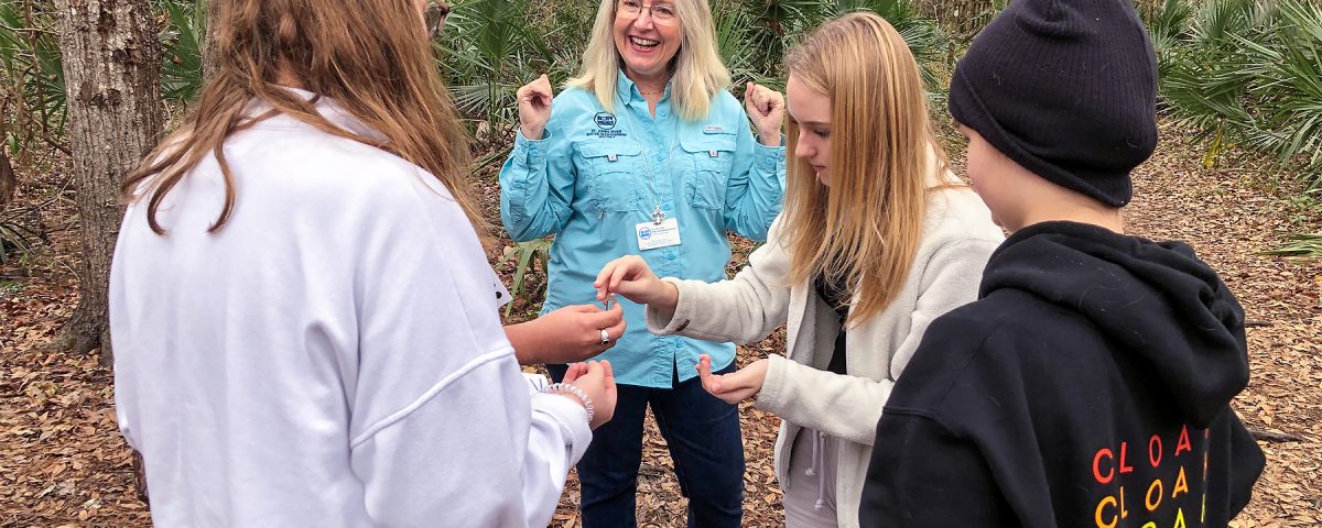 Dr. Ann Shortelle with students in the woods
