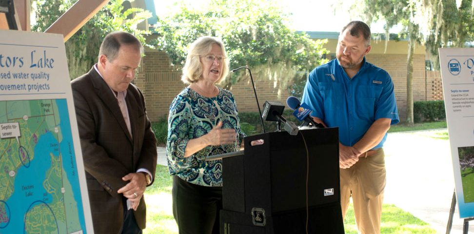 Pictured: Rep. Travis Cummings, District Executive Director Dr. Ann Shortelle and Sen. Rob Bradley at the August 2018 legislative funding announcement event.