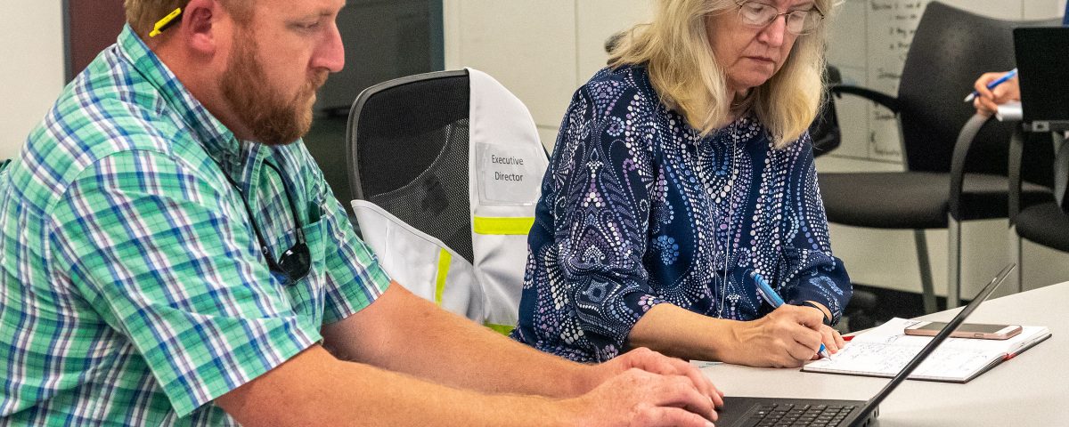 Dave Dickens sitting with Dr. Ann Shortelle