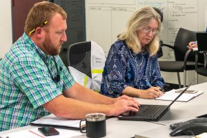 Dave Dickens sitting with Dr. Ann Shortelle