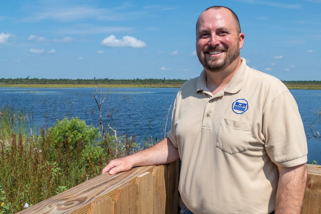 Graham Williams standing next to a railing