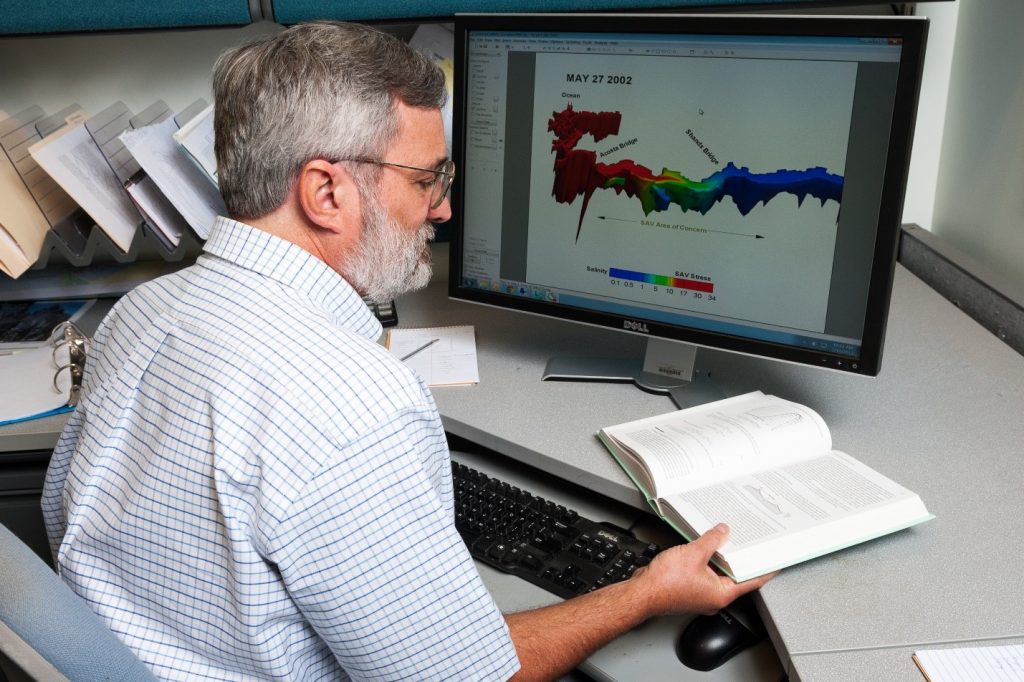 Dr. Peter Sucsy looking at computer models