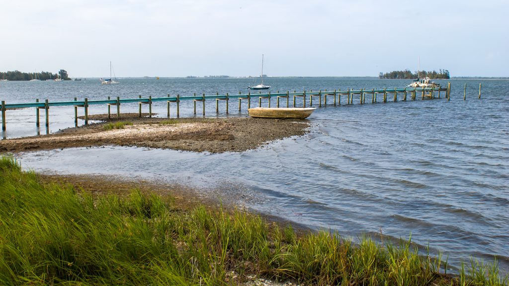 A pier extending out in to the Indian River Lagoon