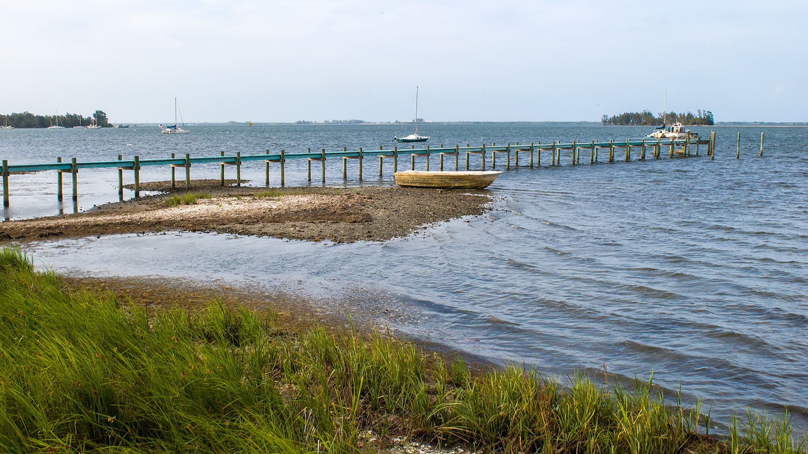 A pier extending out in to the Indian River Lagoon
