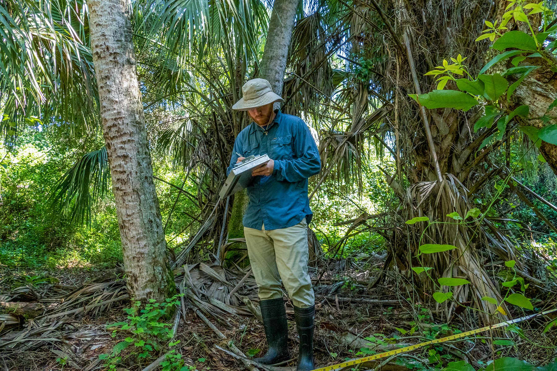 Nathaniel Mouzon standing in a forest