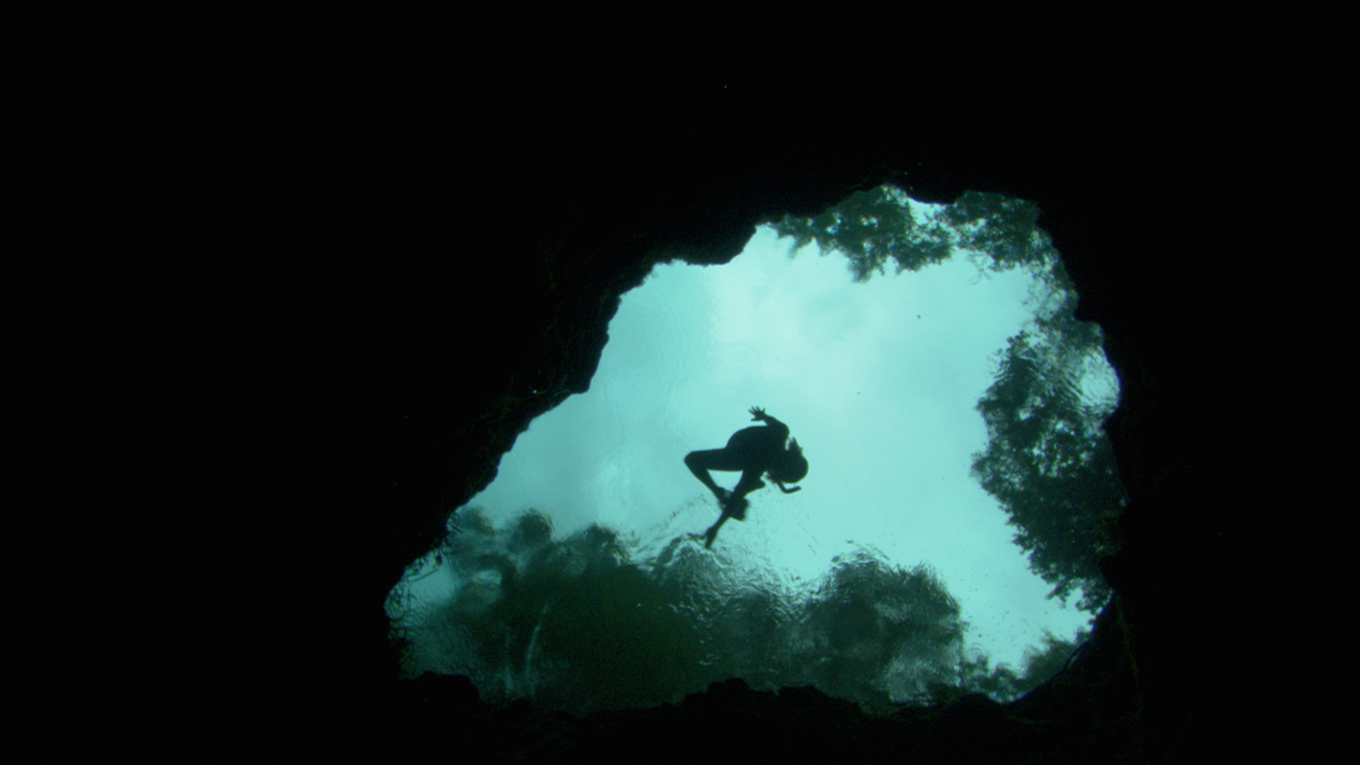 Tessa Skiles free dives into an aquafer
