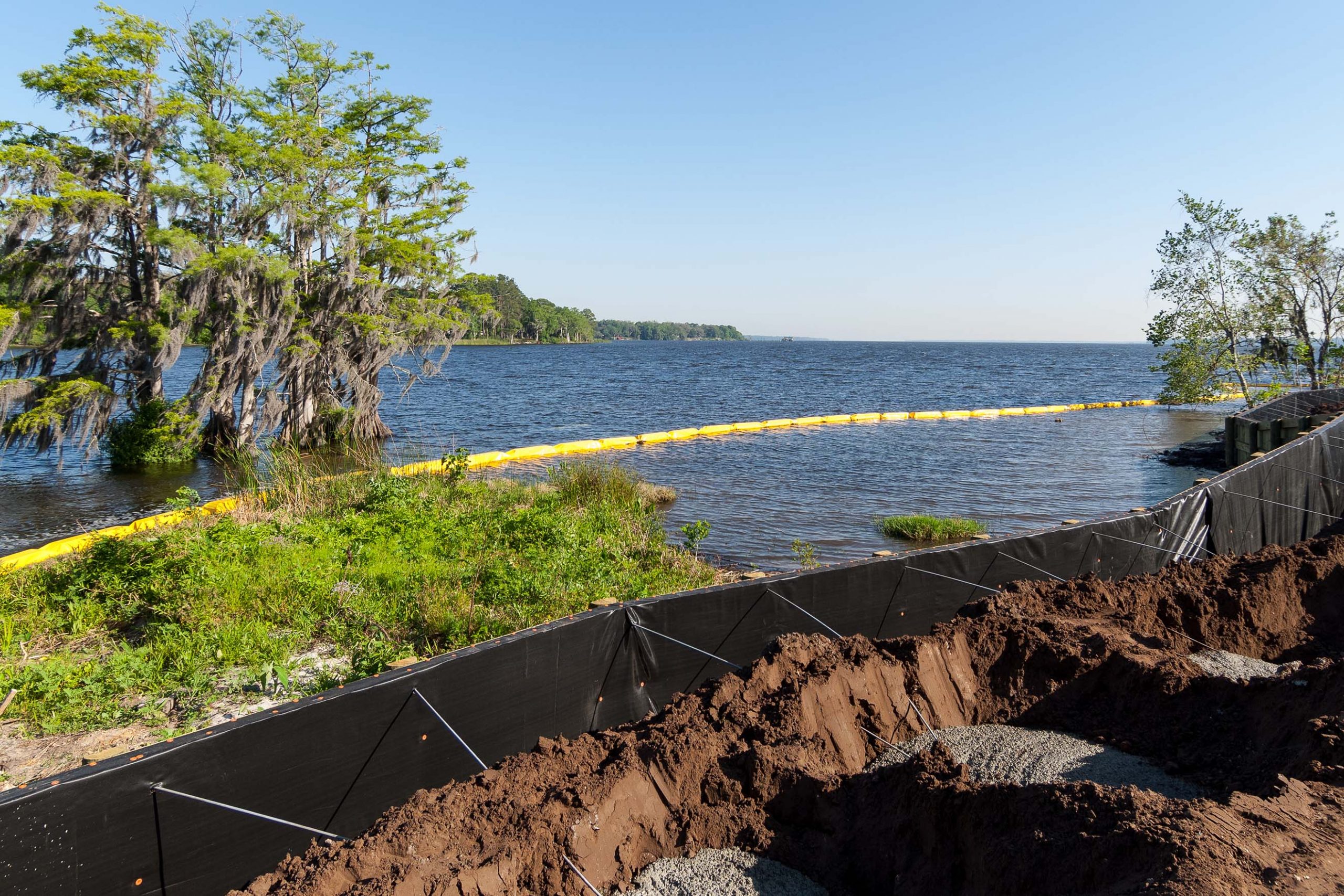 Sectioned off wetland using a black barricade