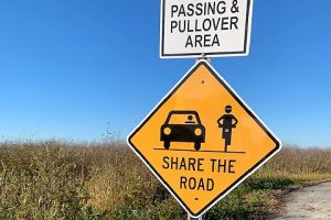 Share the road sign
