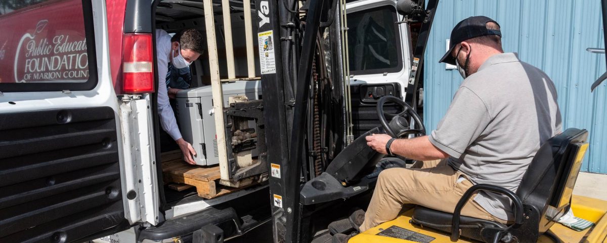 Man lifting equipment using a forklift