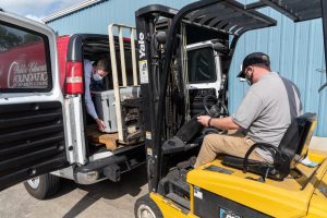 Man lifting equipment using a forklift