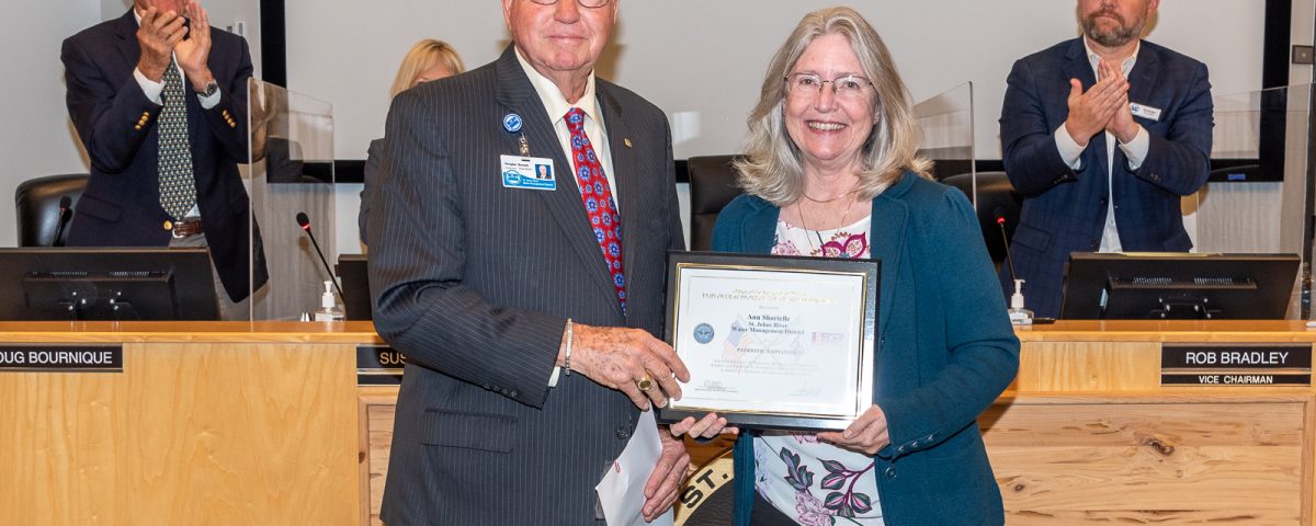 Dr. Ann Shortelle with Governing Board Chairman Gen. Douglas Burnett