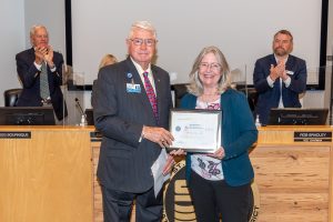 Dr. Ann Shortelle with Governing Board Chairman Gen. Douglas Burnett
