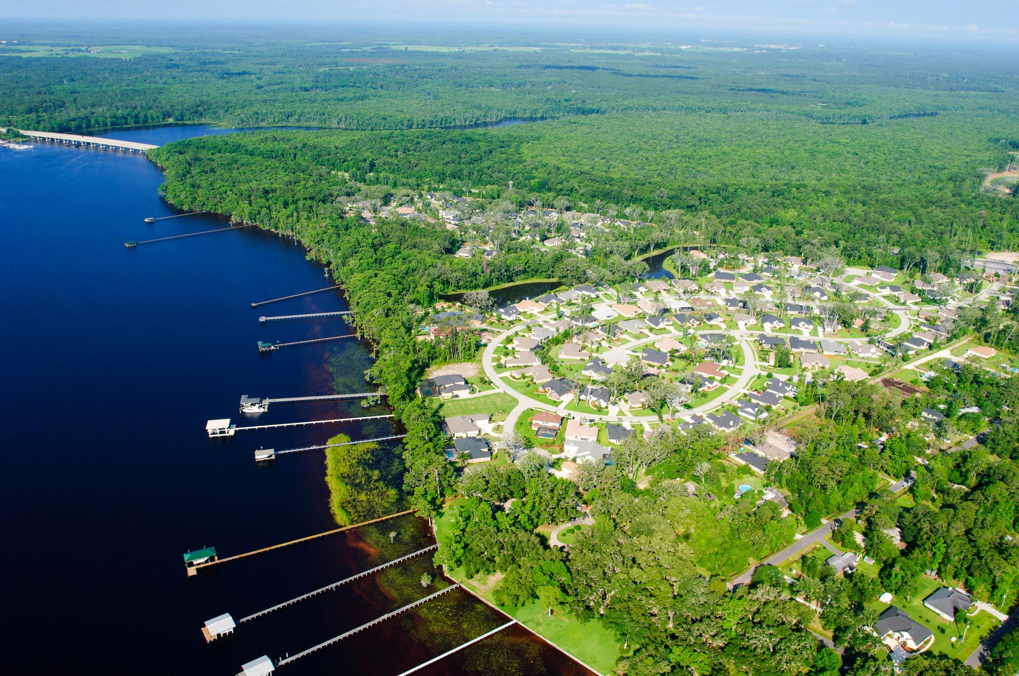 Aerial view of a residential community by a river