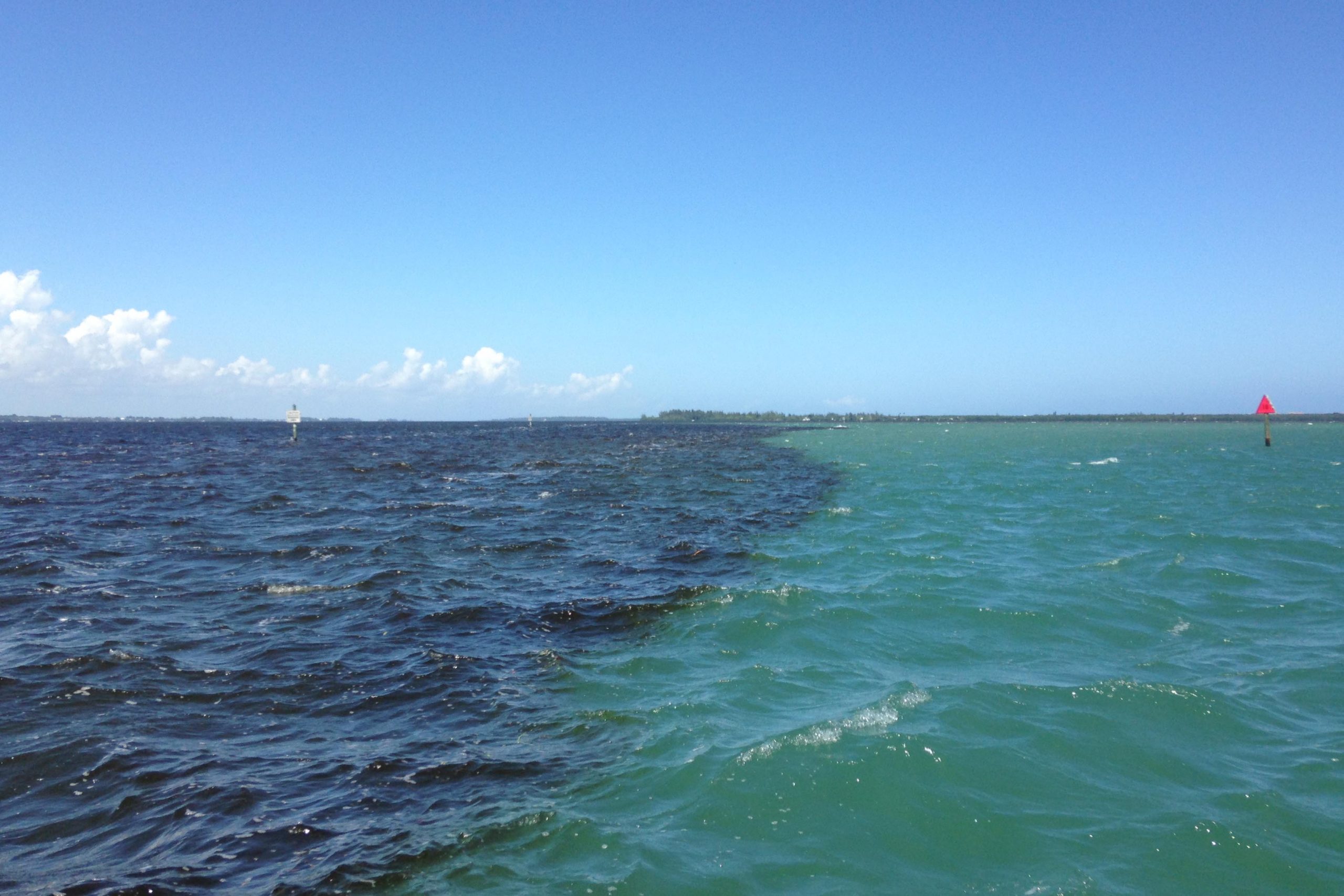 Dark water running into lighter water