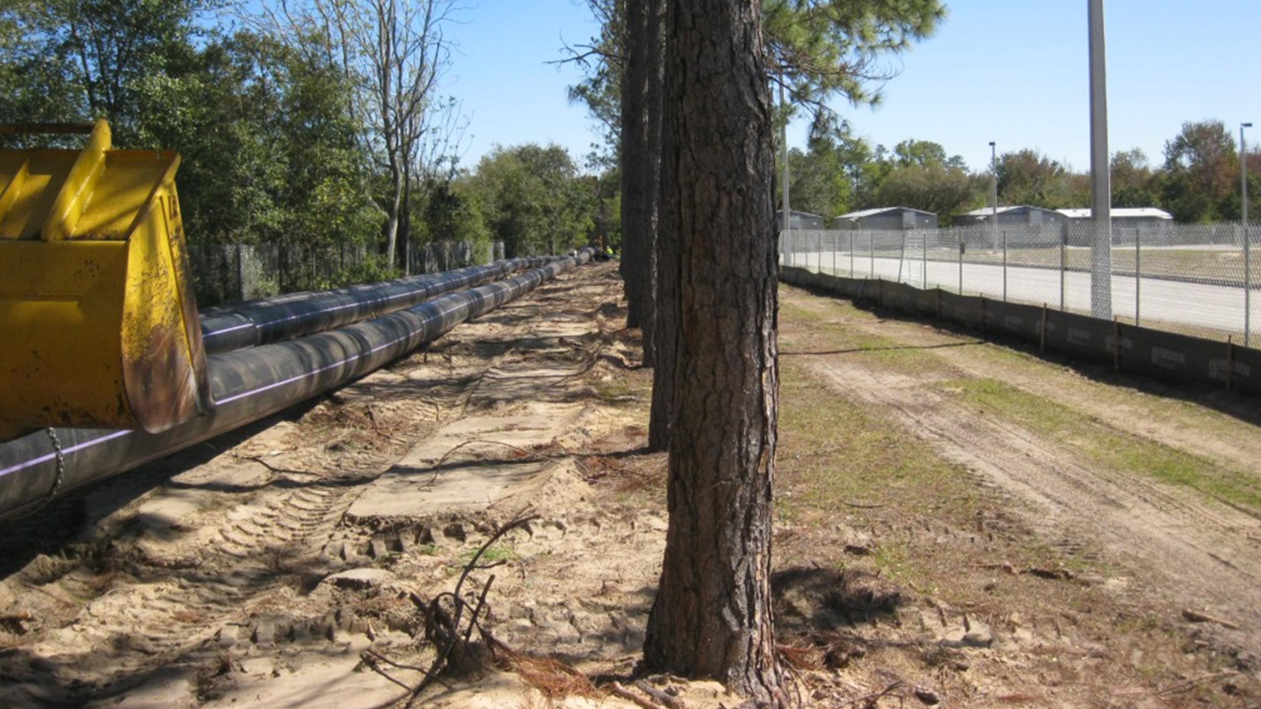 Sewage pipes being layed down by a road